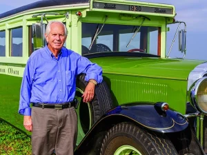 Reg DeNure is seen in this photograph taken about two years ago with the 1930 Buick bus, which was the "flagship" of his collection of vintage vehicles of which he and his father, Ivan, were "beyond proud," said his son Brent DeNure.