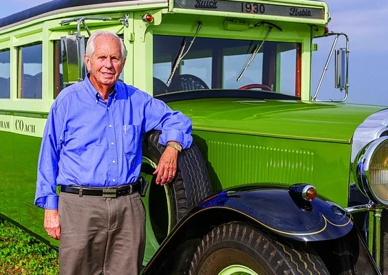 Reg DeNure is seen in this photograph taken about two years ago with the 1930 Buick bus, which was the "flagship" of his collection of vintage vehicles of which he and his father, Ivan, were "beyond proud," said his son Brent DeNure.
